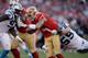 SAN FRANCISCO, CA - NOVEMBER 10: Colin Kaepernick #7 of the San Francisco 49ers is sacked by Luke Kuechly #59 of the Carolina Panthers at Candlestick Park on November 10, 2013 in San Francisco, California. (Photo by Ezra Shaw/Getty Images)