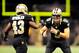 NEW ORLEANS, LA - NOVEMBER 10: Drew Brees #9 of the New Orleans Saints congratulates Darren Sproles #43 following a touchdown during a game against the Dallas Cowboys at the Mercedes-Benz Superdome on November 10, 2013 in New Orleans, Louisiana. (Photo