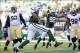 Nov 3, 2013; East Rutherford, NJ, USA; New York Jets quarterback Geno Smith (7) scores a touchdown against the New Orleans Saints during the first half at MetLife Stadium. Mandatory Credit: Joe Camporeale-USA TODAY Sports
