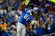 Oct 20, 2013; Detroit, MI, USA; Detroit Lions wide receiver Calvin Johnson (81) celebrates by dunking the ball over the goal post after catching a pass for a touchdown during the fourth quarter against the Cincinnati Bengals at Ford Field. Mandatory Credi