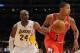 LOS ANGELES, CA - DECEMBER 25: Derrick Rose #1 of the Chicago Bulls drives against Kobe Bryant #24 of the Los Angeles Lakers at Staples Center on December 25, 2011 in Los Angeles, California. NOTE TO USER: User expressly acknowledges and agrees that, by