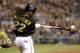 Oct 1, 2013; Pittsburgh, PA, USA; Pittsburgh Pirates center fielder Andrew McCutchen (22) hits a single against the Cincinnati Reds in the sixth inning of the National League wild card playoff baseball game at PNC Park. The Pirates won 6-2. Mandatory Cred