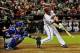 Sept 3, 2013; Phoenix, AZ, USA; Arizona Diamondbacks first baseman Paul Goldschmidt (44) hits a single as Toronto Blue Jays catcher J.P. Arencibia (9) looks on during the fourth inning at Chase Field. Mandatory Credit: Matt Kartozian-USA TODAY Sports