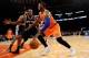 NEW YORK, NY - NOVEMBER 10: Metta World Peace #51 of the New York Knicks drives against Kawhi Leonard #2 of the San Antonio Spurs duirng the first half at Madison Square Garden on November 10, 2013 in New York City. NOTE TO USER: User expressly acknowled