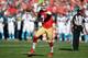 SAN FRANCISCO, CA - NOVEMBER 10: Colin Kaepernick #7 of the San Francisco 49ers rolls out to pass against the Carolina Panthers during the second quarter at Candlestick Park on November 10, 2013 in San Francisco, California. (Photo by Thearon W. Henders