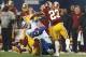 Oct 13, 2013; Arlington, TX, USA; Dallas Cowboys tight end Jason Witten (82) is hit after a catch by Washington Redskins cornerback DeAngelo Hall (23) and linebacker London Fletcher (59) at AT&T Stadium. The Dallas Cowboys beat the Washington Redskins 31-