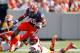 EAST RUTHERFORD, NJ - SEPTEMBER 08: Jerome Smith #45 of the Syracuse Orange is hit by Anthony Brown #16 of the USC Trojans during a game at MetLife Stadium on September 8, 2012 in East Rutherford, New Jersey. (Photo by Rich Schultz/Getty Images)