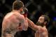 Mar 16, 2013; Montreal, Quebec, CAN; Johny Hendricks (blue) lands a punch on Carlos Condit (red) during their main card bout at UFC 158 at the Bell Centre. Mandatory Credit: Eric Bolte-USA TODAY Sports