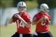 May 20, 2013; Alameda, CA, USA; Oakland Raiders quarterbacks Matt McGloin (14) and Tyler Wilson (8) throw a pass at organized team activities at the Raiders practice facility. Mandatory Credit: Kirby Lee-USA TODAY Sports