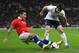 LONDON, ENGLAND - NOVEMBER 15: Leighton Baines of England is tackled by Eduardo Vargas of Chile during the international friendly match between England and Chile at Wembley Stadium on November 15, 2013 in London, England. (Photo by Clive Brunskill/Getty