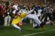 LOS ANGELES, CA - NOVEMBER 16: Wide receiver Marqise Lee #9 of the USC Trojans catches a pass for a two-point conversion, while being tackled by safety Jordan Richards #8 of the Stanford Cardinal in the first half at Los Angeles Coliseum on November 16,