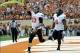 Nov 16, 2013; Austin, TX, USA; Oklahoma State Cowboys quarterback Clint Chelf (10) and fulback Desmond Roland (9) celebrate after a touchdown against the Texas Longhorns during the first quarter at Darrell K Royal-Texas Memorial Stadium. Mandatory Credit: