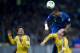 KIEV, UKRAINE - NOVEMBER 15: Patrice Evra (C) of France fights for the ball with Ukraine's Edmar Halovskyi (L) and Ukraine's Roman Zozulya (R) during the FIFA 2014 World Cup Qualifier Play-off First Leg soccer match between Ukraine and France at the Olym