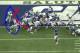 Conner leads the way on Andre Brown’s third quarter, one-yard touchdown run against Oakland by knocking safety Charles Woodson out of the way.