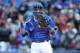 TORONTO, CANADA - SEPTEMBER 14: J.P. Arencibia #9 of the Toronto Blue Jays celebrates the final out of their victory during MLB game action against the Baltimore Orioles on September 14, 2013 at Rogers Centre in Toronto, Ontario, Canada. (Photo by Tom Szc