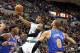 Oct 13, 2012; Hartford, CT, USA; Boston Celtics guard Rajon Rondo (9) shoots the ball against New York Knicks forward Carmelo Anthony (7) and center Tyson Chandler (6) during the first half at XL Center. Mandatory Credit: Mark L. Baer-USA TODAY Sports