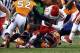 Nov 17, 2013; Denver, CO, USA; Denver Broncos defensive end Shaun Phillips (90) and middle linebacker Wesley Woodyard (52) tackle Kansas City Chiefs quarterback Alex Smith (11) in the first quarter at Sports Authority Field at Mile High. Mandatory Credit: