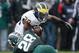 EAST LANSING, MI - NOVEMBER 02: Denicos Allen #28 of the Michigan State Spartans brings down Fitzgerald Toussaint #28 of the Michigan Wolverines in the second quarter at Spartan Stadium on November 2, 2013 in East Lansing, Michigan. (Photo by Gregory Sha