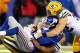 EAST RUTHERFORD, NJ - NOVEMBER 17: Eli Manning #10 of the New York Giants is sacked by Brad Jones #59 and Clay Matthews #52 of the Green Bay Packers at MetLife Stadium on November 17, 2013 in East Rutherford, New Jersey.The New York Giants defeated the G