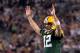 ARLINGTON, TX - FEBRUARY 06: Aaron Rodgers #12 of the Green Bay Packers celebrates after an 8 yard touchdown pass to Greg Jennings against the Pittsburgh Steelers during Super Bowl XLV at Cowboys Stadium on February 6, 2011 in Arlington, Texas. (Photo b