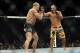 Nov 16, 2013; Las Vegas, NV, USA; Georges St-Pierre (red gloves) fights against Johny Hendricks (blue gloves) in their welterweight championship bout during UFC 167 at MGM Grand Garden Arena. Mandatory Credit: Stephen R. Sylvanie-USA TODAY Sports
