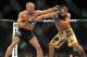Nov 16, 2013; Las Vegas, NV, USA; Georges St-Pierre (red gloves) fights against Johny Hendricks (blue gloves) in their welterweight championship bout during UFC 167 at MGM Grand Garden Arena. Mandatory Credit: Stephen R. Sylvanie-USA TODAY Sports