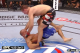 Lawler catches MacDonald's feet and attempts a double ankle sweep.