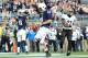 Nov 16, 2013; University Park, PA, USA; Penn State Nittany Lions quarterback Christian Hackenberg (14) runs into the end zone for a touchdown in front of Purdue Boilermakers cornerback Ricardo Allen (21) during the fourth quarter at Beaver Stadium. Penn