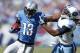 NASHVILLE, TN - SEPTEMBER 23: Nate Burleson #13 of the Detroit Lions runs after a reception against Michael Griffin #33 of the Tennessee Titans during the game at LP Field on September 23, 2012 in Nashville, Tennessee. The Titans won 44-41 in overtime. (P