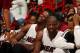 MIAMI, FL - NOVEMBER 3: Chris Bosh #1 and Dwyane Wade #3 of the Miami Heat smiles against the Washington Wizards on November 3, 2013 at American Airlines Arena in Miami, Florida. NOTE TO USER: User expressly acknowledges and agrees that, by downloading an