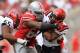 COLUMBUS, OH - SEPTEMBER 7: Michael Bennett #63 of the Ohio State Buckeyes stops Chase Price #22 of the San Diego State Aztecs in the backfield during the third quarter at Ohio Stadium on September 7, 2013 in Columbus, Ohio. Ohio State defeated San Diego