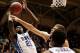 Nov 19, 2013; Durham, NC, USA; East Carolina Pirates forward Michael Zangari (34) defends against Duke Blue Devils forward Amile Jefferson (21) as he shoots at Cameron Indoor Stadium. Mandatory Credit: Mark Dolejs-USA TODAY Sports