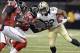 Sep 8, 2013; New Orleans, LA, USA; New Orleans Saints running back Mark Ingram (22) carries the ball up the sidelines against Atlanta Falcons free safety Thomas DeCoud (28) during the second quarter at the Mercedes-Benz Superdome. Mandatory Credit: John D