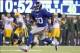 Nov 17, 2013; East Rutherford, NJ, USA; New York Giants defensive end Jason Pierre-Paul (90) runs back an interception against the Green Bay Packers for a touchdown during the fourth quarter of a game at MetLife Stadium. Mandatory Credit: Brad Penner-USA