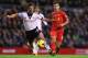 LIVERPOOL, ENGLAND - NOVEMBER 09: Scott Parker of Fulham competes with Coutinho of Liverpool during the Barclays Premier League match between Liverpool and Fulham at Anfield on November 9, 2013 in Liverpool, England. (Photo by Alex Livesey/Getty Images)