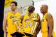 EL SEGUNDO, CA - SEPTEMBER 25: Kobe Bryant #24 of the Los Angeles Lakers laughs as he holds two NBA Finals Larry O'Brien Championship Trophy's as he poses for a photograph with teammates Pau Gasol #16 and Derek Fisher #2 during Media Day at the Toyota C