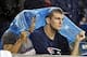Sep 12, 2013; Foxborough, MA, USA; A pair of New England Patriots fans watch from the stands in the rain during the fourth quarter against the New York Jets at Gillette Stadium. The New England Patriots won 13-10. Mandatory Credit: Greg M. Cooper-USA TOD