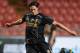 BANGKOK, THAILAND - JULY 27: Martin Kelly of Liverpool FC kicks the ball during a Liverpool FC training session at Rajamangala Stadium on July 27, 2013 in Bangkok, Thailand. (Photo by Thananuwat Srirasant/Getty Images)