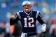 FOXBORO, MA - NOVEMBER 3: Tom Brady #12 of the New England Patriots reacts to the cheers of fans as he runs onto the field before a game with the Pittsburgh Steelers at Gillette Stadium on November 3, 2013 in Foxboro, Massachusetts. (Photo by Jim Rogash/G