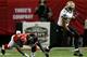 ATLANTA, GA - NOVEMBER 21: Running back Pierre Thomas #23 of the New Orleans Saints avoids a tackle by cornerback Desmond Trufant #21 of the Atlanta Falcons during a game at the Georgia Dome on November 21, 2013 in Atlanta, Georgia. (Photo by Kevin C. Co