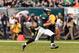 Nov 17, 2013; Philadelphia, PA, USA; Philadelphia Eagles quarterback Nick Foles (9) carries the ball during the fourth quarter against the Washington Redskins at Lincoln Financial Field. The Eagles defeated the Redskins 24-16. Mandatory Credit: Howard Smi