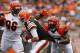 CLEVELAND, OH - SEPTEMBER 29: Quarterback Brian Hoyer #6 of the Cleveland Browns scrambles from defenders Carlos Dunlap #96 and Geno Atkins #97 the Cincinnati Bengals at FirstEnergy Stadium on September 29, 2013 in Cleveland, Ohio. (Photo by Matt Sulli