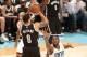 CHARLOTTE, NC - NOVEMBER 20: Kemba Walker #15 of the Charlotte Bobcats attempts to block a shot against Deron Williams #8 of the Brooklyn Nets during the game at the Time Warner Cable Arena on November 20, 2013 in Charlotte, North Carolina. NOTE TO USER