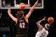 Nov 18, 2013; Brooklyn, NY, USA; Portland Trail Blazers center Robin Lopez (42) defends Brooklyn Nets power forward Reggie Evans (30) at the net during the first quarterat Barclays Center. Mandatory Credit: Anthony Gruppuso-USA TODAY Sports