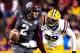 BATON ROUGE, LA - NOVEMBER 23: Quarterback Johnny Manziel #2 of the Texas A&M Aggies is flushed out of the pocket by defensive end Jermauria Rasco #59 of the LSU Tigers at Tiger Stadium on November 23, 2013 in Baton Rouge, Louisiana. (Photo by Sean Gard