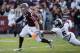 COLLEGE STATION, TX - NOVEMBER 09: Johnny Manziel #2 of the Texas A&M Aggies runs to avoid the tackle of Jamerson Love #5 of the Mississippi State Bulldogs at Kyle Field on November 9, 2013 in College Station, Texas. (Photo by Scott Halleran/Getty Image