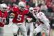 Nov 23, 2013; Columbus, OH, USA; Ohio State Buckeyes quarterback Braxton Miller (5) breaks a tackle by Indiana Hoosiers cornerback Tim Bennett (24) in the first quarter of the game at Ohio Stadium. Mandatory Credit: Trevor Ruszkowksi-USA TODAY Sports
