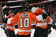 PHILADELPHIA, PA - NOVEMBER 23: Brayden Schenn #10 of the Philadelphia Flyers celebrates his third period goal against the New York Islanders with teammates Luke Schenn #22 (L) and Jakub Voracek #93 (R) on November 23, 2013 at the Wells Fargo Center in Ph