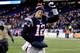 FOXBORO, MA - NOVEMBER 24: Quarterback Tom Brady #12 of the New England Patriots walks off the field after a game at Gillette Stadium on November 24, 2013 in Foxboro, Massachusetts. (Photo by Jim Rogash/Getty Images)