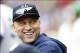 Sep 14, 2013; Boston, MA, USA; New York Yankees shortstop Derek Jeter (2) smiles in the dugout during the second inning against the Boston Red Sox at Fenway Park. Mandatory Credit: Greg M. Cooper-USA TODAY Sports